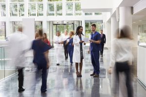 travel nursing vs. staff nursing - image of busy hospital lobby
