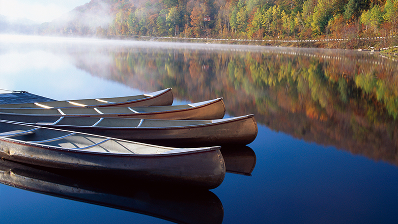 Three canoes on a lake