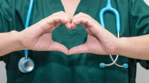 Picture of nurse making heart with her hands