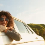 Picture of traveling nurse looking out the window of her car